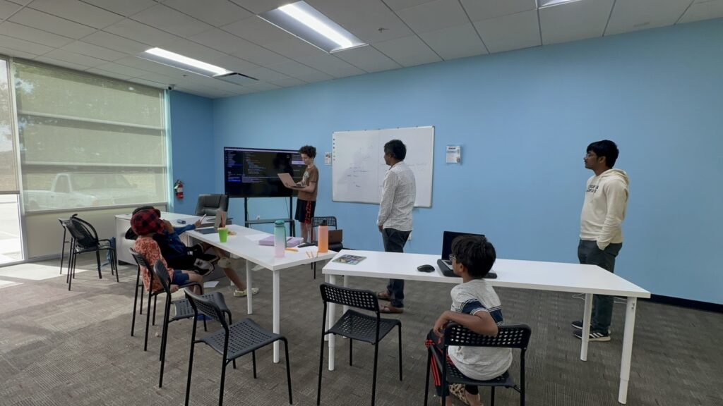 Students participating in Python summer camp activities at Y2L Academy.